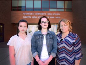 Left, Marley Stasiuk (Grade 10), her sister Landry (Grade 12) and their mother Tanya in Okotoks, on April 11, 2017. The Stasiuk family has been in a battle with Foothills Composite High School over school fees they don't feel are legal under the Alberta School Act.
