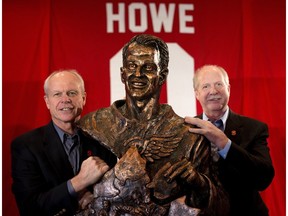 Mark Howe, left, and brother Marty Howe with a statue of their father, Gordie Howe, that was unveiled during the Dementia Symposium in Calgary on Friday April 7, 2017. (Leah Hennel)