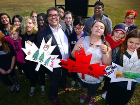 Mayor Naheed Nenshi and students from Ernest Morrow School show how some families and neighbours will celebrate Neighbour Day in Calgary, Alta., on April 19, 2017 creating art to celebrate Canada 150. Neighbour Day is on June 17, with a deadline for event permits being May 26. The City of Calgary will be waiving its fees for approved block parties. Ryan McLeod/Postmedia Network