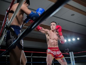 Scott MacKenzie, right, photographed during a Muay Thai fight on March 4 at Winsport's Markin MacPhail Centre in Calgary.