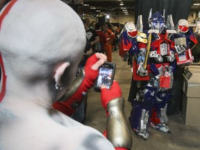 Optimus Prime is photographed by a fellow cosplayer during the 2014 Calgary Comic and Entertainment Expo.