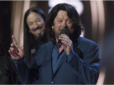 Paul Langlois and Rob Baker accept the award for The Tragically Hip winning the award for Group of the Year at the Juno awards show Sunday April 2, 2017 in Ottawa.