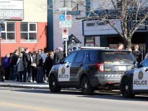 Police watched as Calgarians lined up outside the Plaza Theatre in Kensington to see the controversial men's rights film The Red Pill on Tuesday April 4, 2017.