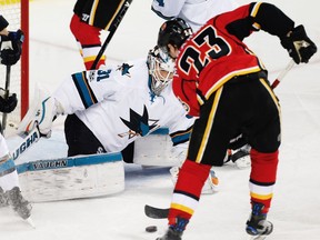 Calgary Flames Sean Monahan scores on San Jose Sharks goalie Martin Jones during NHL hockey in Calgary, Alta., on Friday, March 31, 2017. AL CHAREST/POSTMEDIA