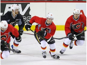 Calgary Flames from left;  Michael Frolik , Dougie Hamilton Matthew Tkachuk and Mikael Backlund  skate up ice during practise at the Scotiabank Saddledome in Calgary on Monday April 10, 2017. The Flames begin their playoff run against the Ducks in Anaheim on Thursday.