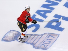 The Calgary Flames' Matthew Tkachuk skates over the Stanley Cup playoffs logo during practice at the Scotiabank Saddledome in Calgary on Monday April 10, 2017. The Flames begin their playoff run against the Ducks in Anaheim on Thursday. (Gavin Young)