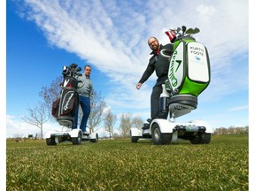Kurtis Foote, head golf pro at the Woodside Golf Course in Airdrie, gives some tips on Sunday, April 30, 2017, to Postmedia sports writer Wes Gilbertson on the Golf Boards the course will soon have available to rent. (Gavin Young)