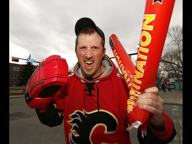 Flames fan MacKenzie Senger is pumped as he makes his way to the Saddledome for game 3 along the Red Mile in Calgary on Monday April 17, 2017. DARREN MAKOWICHUK/Postmedia Network