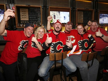 Flames fans cheer on for game 3 at Trolley 5 Restaurant and Brewery along the Red Mile in Calgary on Monday April 17, 2017. DARREN MAKOWICHUK/Postmedia Network