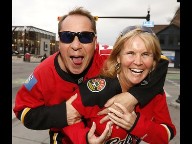 Flames fans were pumped as they makes their way to the Saddledome for game 3 along the Red Mile in Calgary on on Monday April 17, 2017. DARREN MAKOWICHUK/Postmedia Network