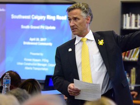 Calgary-Lougheed MLA Dave Rodney moderates a public meeting over the southwest ring road at the Glenmore Christian Academy Thursday.