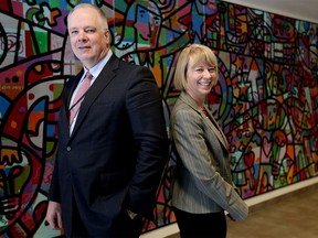 Police chief Roger Chaffin, left and Cherylyn Cameron, Dean of Community Studies at Bow Valley College in Calgary on Tuesday, April 11, 2017, pose for a photo before the police chief speaks on the addiction crisis and how it impacts crime.