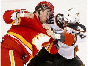 Micheal Ferland of the Calgary Flames fights Nate Thompson of the Anaheim Ducks in Calgary on April 2, 2017. (Lyle Aspinall)