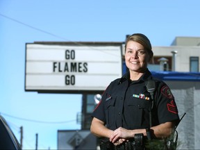 Calgary Police Service Staff Sgt Clare Smart poses in front of a business on 17 Ave SW (informally called The Red Mile) in Calgary, Alta on Tuesday April 4, 2017. Sgt Smart briefed media on plans CPS and the City have for the Calgary Flames playoff run. Jim Wells//Postmedia