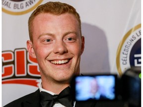 University of Calgary Dinos quarterback Andrew Buckley speaks to media after winning the BLG Award for male athlete of the year in Calgary on May 2, 2016. (File)