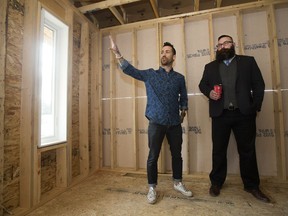 Municipal Affairs Min. Shaye Anderson gets a tour of an under-construction infill home from UrbanAge Homes' Richard Nault, in Edmonton on May 4, 2017. Anderson announced the new New Home Buyer Protection Act legislation during a press conference at the home.