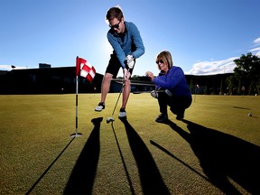 Garrett Desruisseaux, left and Anne Halcro, posing for a photo at the Inglewood Golf Course on Friday May 26, 2017, are both members of the Calgary chapter of Mediocre Golf Association. Leah Hennel/Postmedia