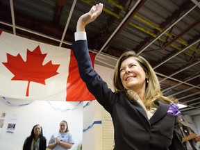 Joan Crockatt waves to her supporters at her campaign headquarters in Calgary on Monday, Oct. 19, 2015.