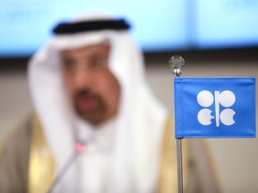 An OPEC flag stands on the desk as Khalid Bin Abdulaziz Al-Falih, Saudi Arabia's energy minister and president of OPEC, speaks during a news conference following the 172nd Organization of Petroleum Exporting Countries (OPEC) meeting in Vienna, Austria, on Thursday, May 25, 2017. OPEC extended oil production cuts for nine more months after last year's landmark agreement failed to eliminate the global oversupply or achieve a sustained price recovery. Photographer: Akos Stiller/Bloomberg ORG XMIT: 700054943