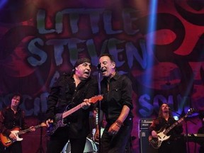 In this Saturday, May 27, 2017 photo, Bruce Springsteen, right, performs at the Count Basie Theatre in Red Bank, N.J., with rocker Steven Van Zandt, left, during the show‚Äôs encore. Springsteen performed a handful of songs including ‚ÄúTenth Avenue Freeze-Out‚Äù when Van Zandt surprised guests and invited Springsteen on stage. (Amanda Stevens/Count Basie Theatre via AP)