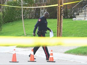 Police investigate a shooting scene in Tuxedo Park on Sunday, May 7, 2017 that left a man with life threatening injuries. Ryan McLeod/Postmedia