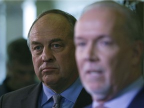 B.C. Green party leader Andrew Weaver and B.C. NDP leader John Horgan speak to media after announcing they'll be working together to help form a minority government during a press conference at Legislature in Victoria, B.C., on Monday, May 29, 2017.