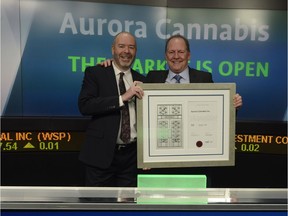 Aurora Cannabis Inc. founders Steve Dobler, left, and Terry Booth ring the TSX opening bell on Dec. 7, 2016.