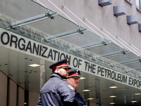 Austrian police officers guard the entrance to the Organization of the Petroleum Exporting Countries (OPEC) headquarters in Vienna, Austria on May 24, 2017 on the eve of the OPEC meeting. /