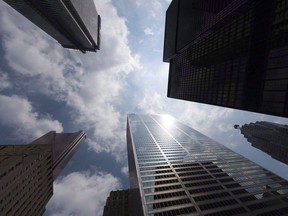 Bank towers are shown from Bay Street in Toronto's financial district, on Wednesday, June 16, 2010. Canada's largest city is getting itself a new resident this year: the headquarters of the federal government's new infrastructure financing agency.Putting the bank in Toronto will give its members easy access to investors in the city's financial district whose dollars the Liberals need to make the agency a success.