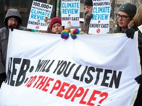 Activists deliver more than 100,000 messages calling on the National Energy Board to review the climate impacts of the Energy East pipeline in Calgary in 2015.