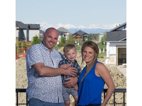 Brett Murrell, Kyla Lewis and Griffin in their new home by Sterling Homes in Drake Landing.