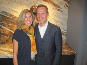 Cal 0506 Ox 4 Pictured with reason to smile at the opening reception of Oxbow Apr 20 in the Kensington Riverside Inn (KRI) are Hotel Arts Group's Mark Wilson and his wife Kerry. The fabulous new restaurant in the KRI is taking the city by storm.