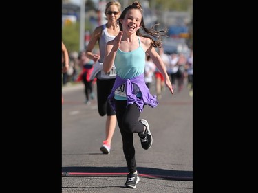 Ava Fleishman, 11, races just a head of her mom Vanessa at the finish line of the Sport Chek Mother's Day Run and Walk at Chinook Centre on Sunday May 14, 2017. The event supports neonatal units in Calgary as well as Jumpstart for Kids.