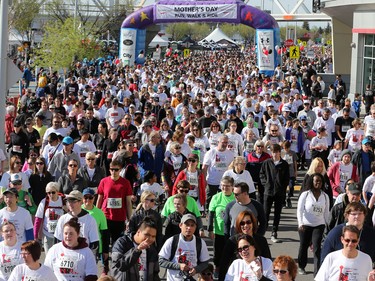 Runners and walkers stride off the start at the Sport Chek Mother's Day Run and Walk at Chinook Centre on Sunday May 14, 2017. The event supports neonatal units in Calgary as well as Jumpstart for Kids.