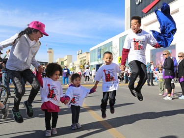 Cousins in the Fernando and Tucker families warm up before the Sport Chek Mother's Day Run and Walk at Chinook Centre on Sunday May 14, 2017. The event supports neonatal units in Calgary as well as Jumpstart for Kids.