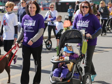 Members of Team Miracle including Teresa Schaffer, left walking with daughter Sydney stride off the start at the Sport Chek Mother's Day Run and Walk at Chinook Centre on Sunday May 14, 2017. The event supports neonatal units in Calgary as well as Jumpstart for kids. Sydney was born at only 25 weeks.