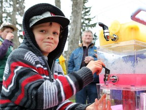 Tate Barton back in 2014 sets up a lemonade stand at the Little Britches Parade on Monday, 19, 2014 to raise money for the cancer centre in the High River Hospital. His mom died recently from cancer. Lorraine Hjalte/Postmedia