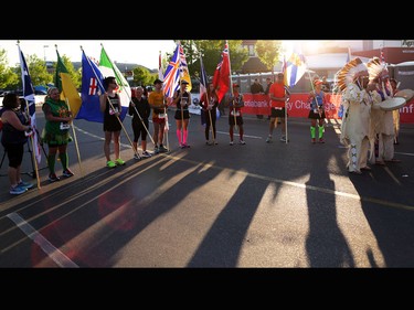 Flag bearers and native singers take part in the opening ceremony at the Scotiabank Calgary Marathon on Sunday May 28, 2017.