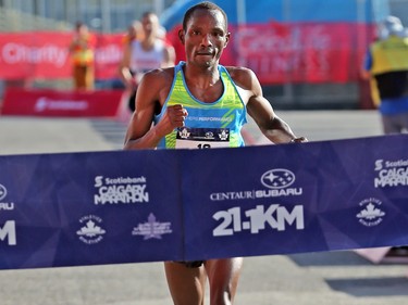 Kip Kangogo crosses the line in first place in the men's division in the half marathon event at the Scotiabank Calgary Marathon on Sunday May 28, 2017.