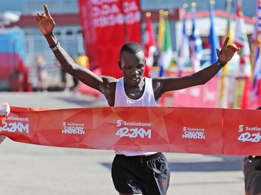 Daniel Kipkoech crosses the line in first place in the men's division of the Scotiabank Calgary Marathon on Sunday May 28, 2017.