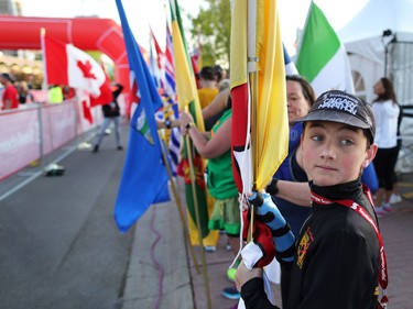 Flag bearers prepare to take part in the opening ceremony at the Scotiabank Calgary Marathon on Sunday May 28, 2017.