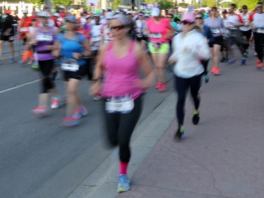 Marathoners and half marathoners race off down the starting stretch of the Scotiabank Calgary Marathon on Sunday May 28, 2017.