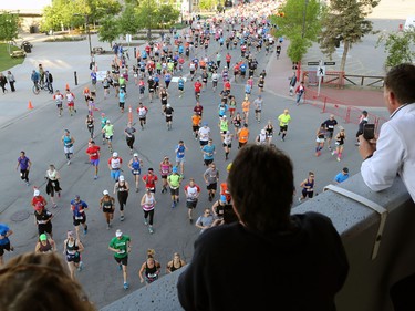 Marathoners and half marathoners race off down the starting stretch of the Scotiabank Calgary Marathon on Sunday May 28, 2017.