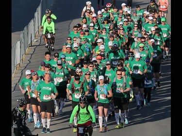 The MitoCanada Calgary Marathon Team heads off the start with over 100 runners tied together in a bid to set a Guinness World Record at the Scotiabank Calgary Marathon on Sunday May 28, 2017.