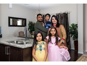 Usman Noman with wife, Mariam and children, Muhammad Ayan (3), Hibbah (6) and Ishmal Fatima (8) in their new home by Excel Homes in Savanna in Saddle Ridge.