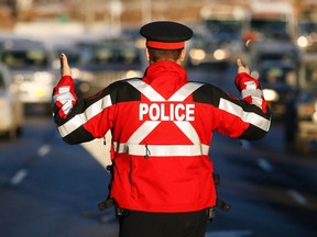 Stuart Gradon, Calgary Herald    CALGARY, AB.: DECEMBER 08, 2010 -- Calgary police start conducting enhanced daytime Check Stops throughout the holiday season on Bow Trail, in Calgary, Alberta Wednesday, December 8, 2010.  (Stuart Gradon/Calgary Herald)   (For City story by None)  00030876A