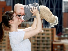Carolyn Davis plays with five-month-old son Alan Eremenko. Calgary is the youngest among the country's metropolitan areas, with just 11 per cent of the population made up of seniors.