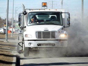 Colleen De Neve/ Calgary Herald CALGARY, AB --MARCH 9, 2015 -- City of Calgary roads crew member Richard Withers drove his street sweeping unit along Portland Road SE on March 9, 2015. Thanks to the milder weather and the lack of snow, crews are starting to hit the streets to get a jump on pre sweeping. (Colleen De Neve/Calgary Herald) (For City story by NONE) 00063263A SLUG: 0310-Sweeping