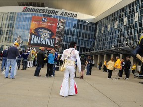 Elvis impersonator Chuck Baril of Gallatin, Tenn., walks along the plaza outside Bridgestone Arena on May 3, 2011.