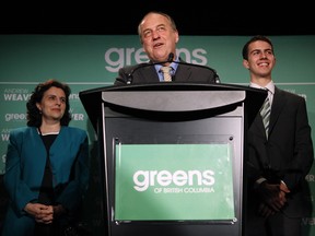 B.C. Green party leader Andrew Weaver is flanked by his wife Helen and son David as he speaks to supporters in Victoria, B.C. Wednesday.